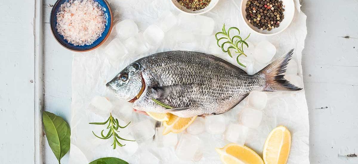 Sea bream fish with lemon, herbs