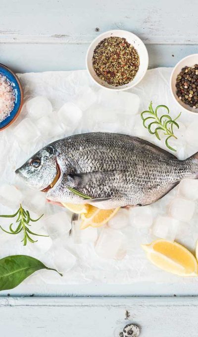 Sea bream fish with lemon, herbs