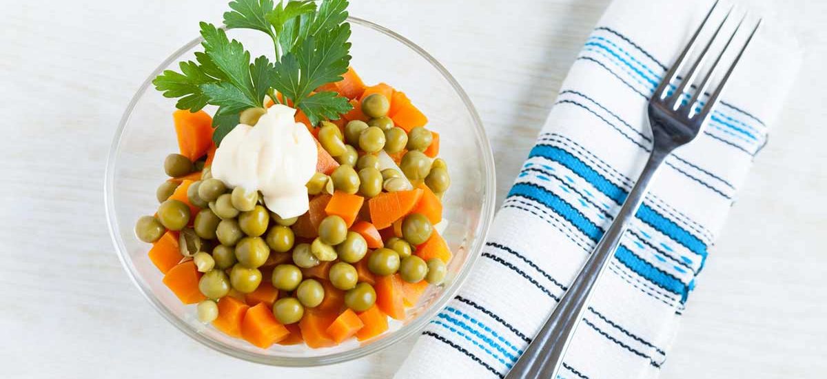 Vegetarian salad with canned peas, boiled carrots